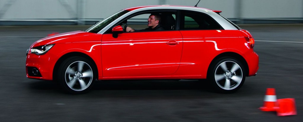 Audi A1/Die Bayernstars und Fussballnationalspieler Philipp Lahm und Bastian Schweinsteiger mit dem neuen Audi A1